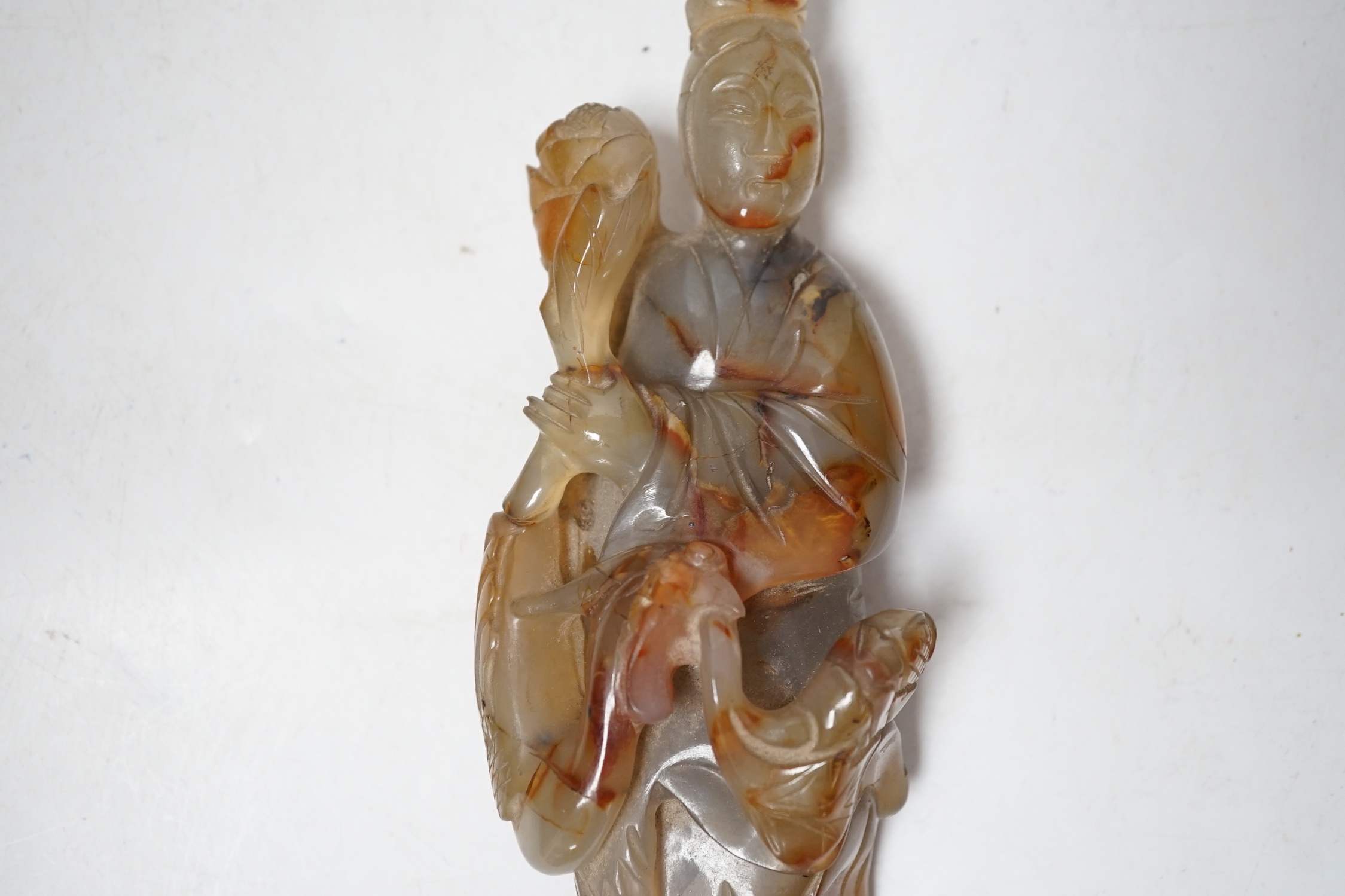 A Chinese carved agate group of Guanyin with a phoenix, 19th century, 17cm high